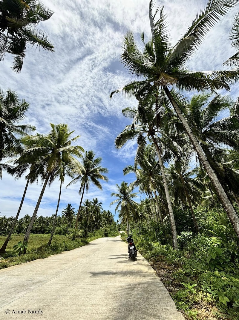 Riding up to Alegria Beach in Siargao through wind and rain